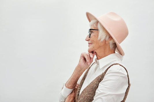 Stylish senior woman in pink hat — personal style
