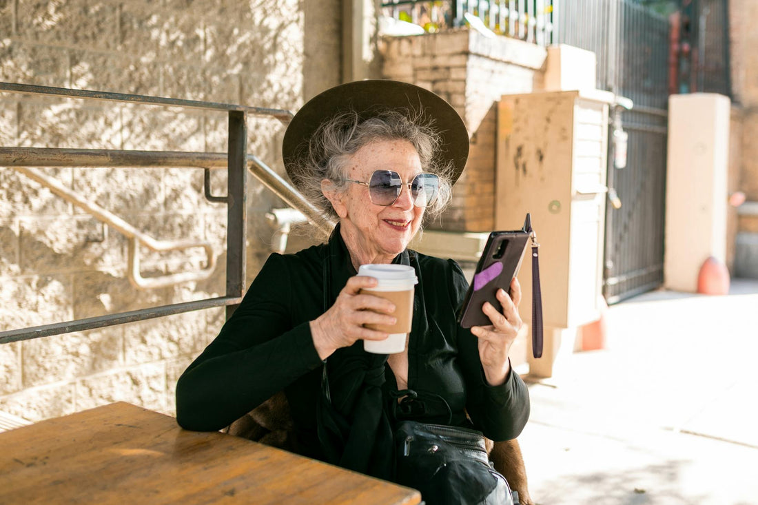 Chic senior woman enjoying coffee outdoors