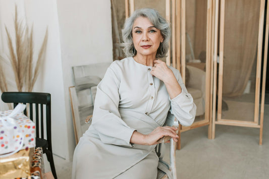 Sophisticated senior woman with silver hair posing gracefully