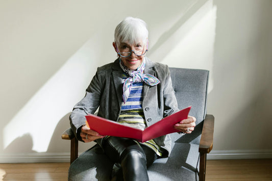 Senior woman with glasses reading