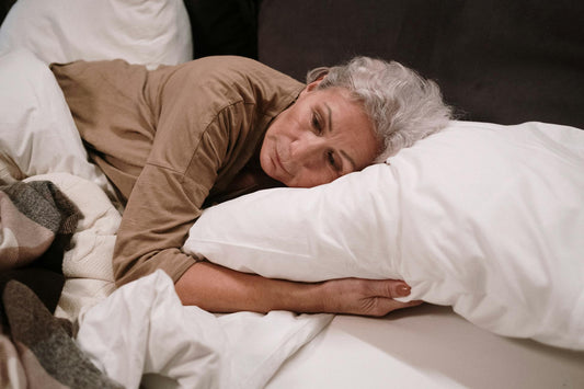 Senior woman in bed resting