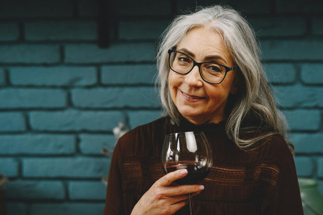 Mature woman with a glass of red wine