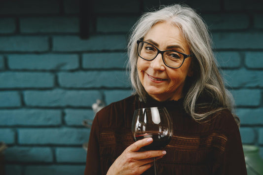 Mature woman with a glass of red wine